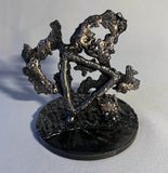 Sculpture de Philippe Buil qui représente le symbole de l'eau à travers la dentelle de métal (Acier et Bronze)