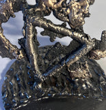 Sculpture de Philippe Buil qui représente le symbole de l'eau à travers la dentelle de métal (Acier et Bronze)
