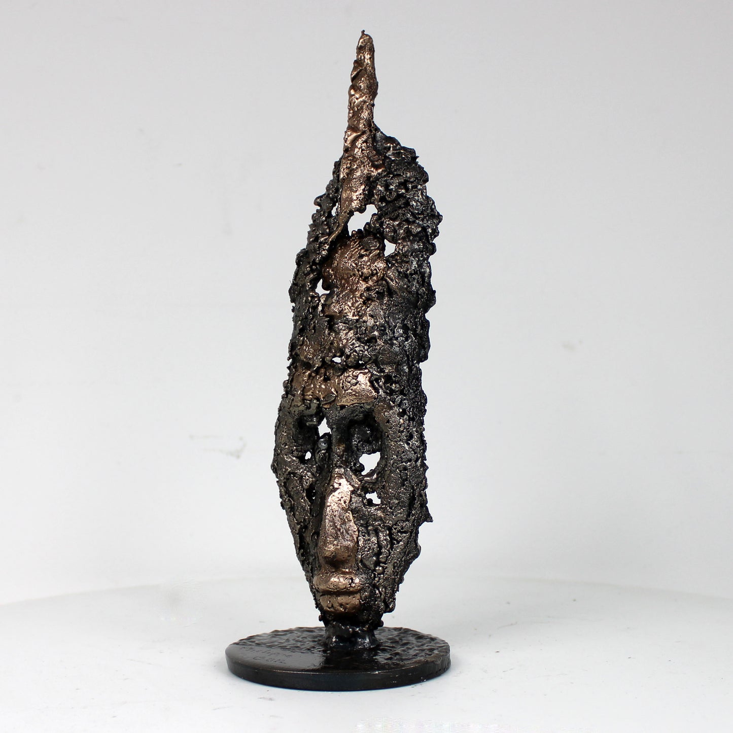 Sculpture visage africain stylisé acier bronze