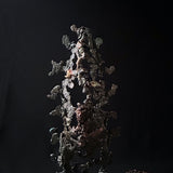 Sculpture abstraite de Philippe Buil : dentelle de métal en acier et bronze, reflets irisées et formes ajourées, œuvre unique contemporaine.